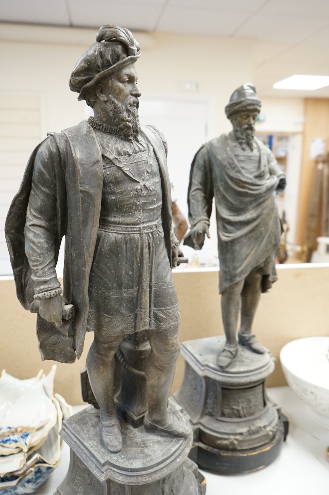 A pair of Victorian spelter figures of Columbus and Gutenberg, 73cm high (damaged)